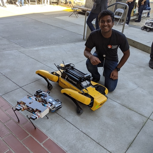 Parthiv with Stanford Pupper and Boston Dynamics Spot robots.